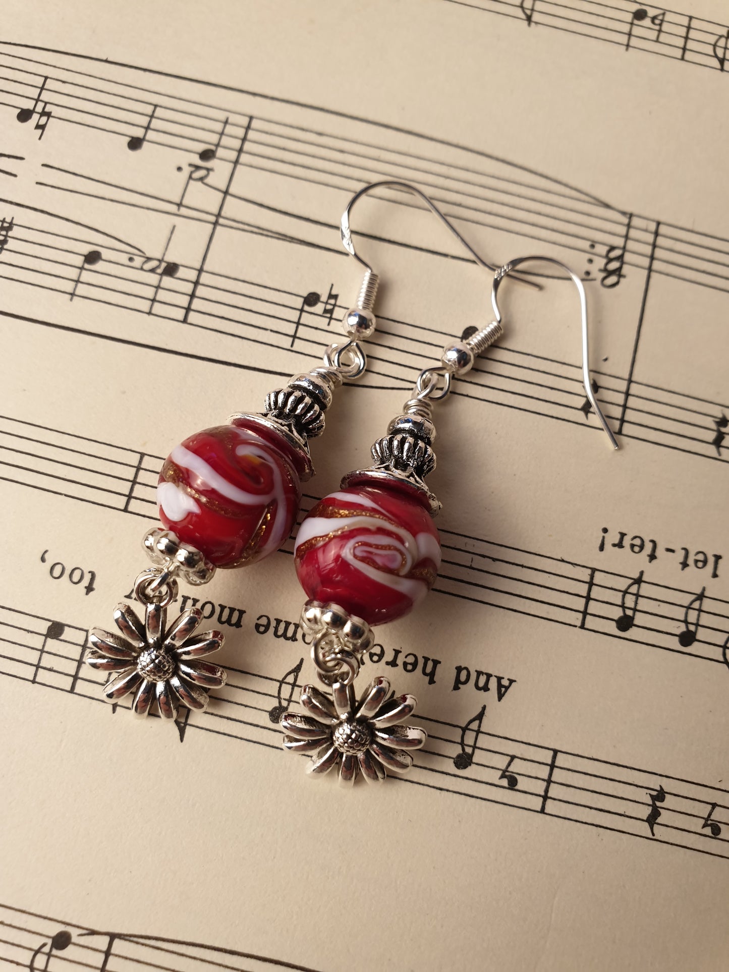 Glass bead and flower design dangle earrings