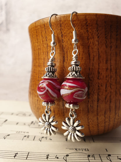 Glass bead and flower design dangle earrings