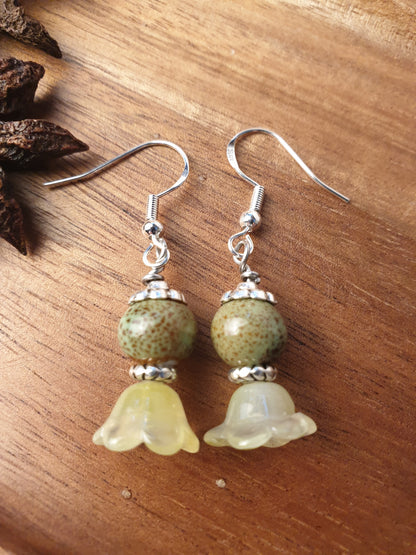 Ceramic bead and glass flower dangle earrings