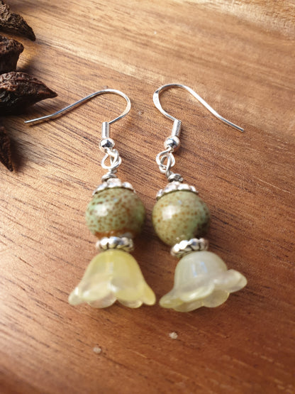 Ceramic bead and glass flower dangle earrings