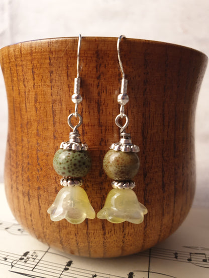 Ceramic bead and glass flower dangle earrings