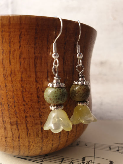 Ceramic bead and glass flower dangle earrings