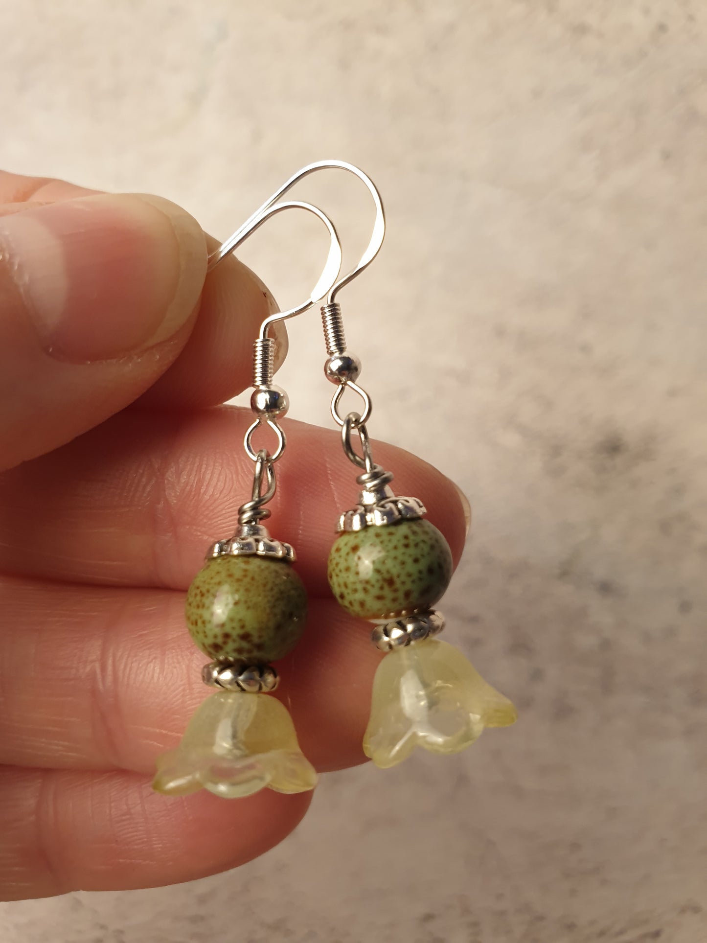 Ceramic bead and glass flower dangle earrings