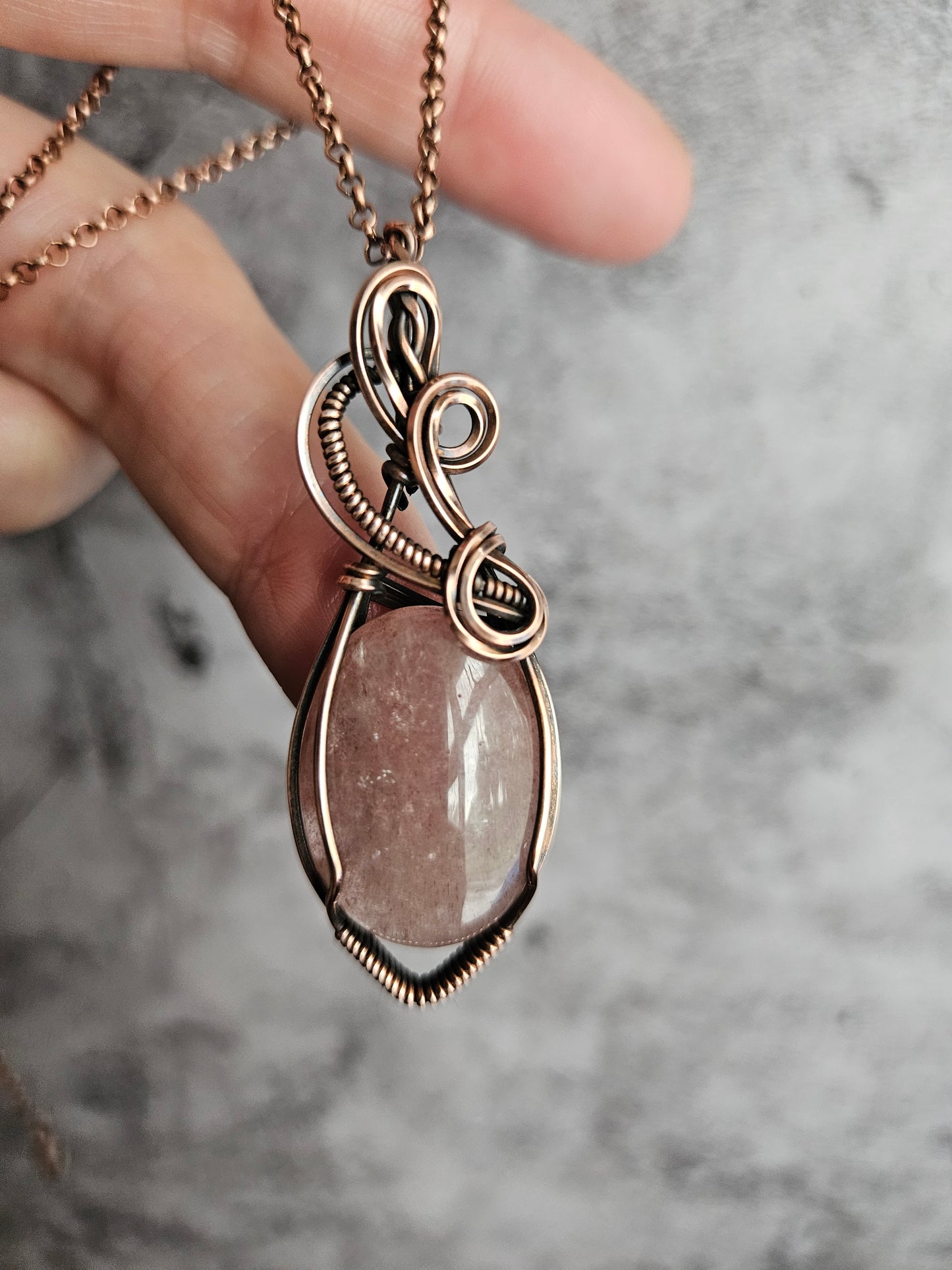 Wire wrapped strawberry quartz pendant