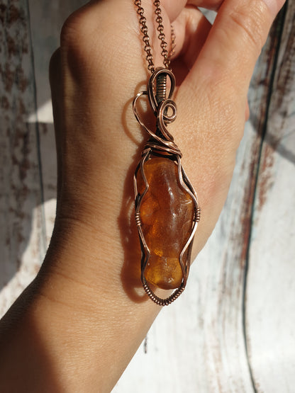 Wire wrapped raw Baltic amber pendant