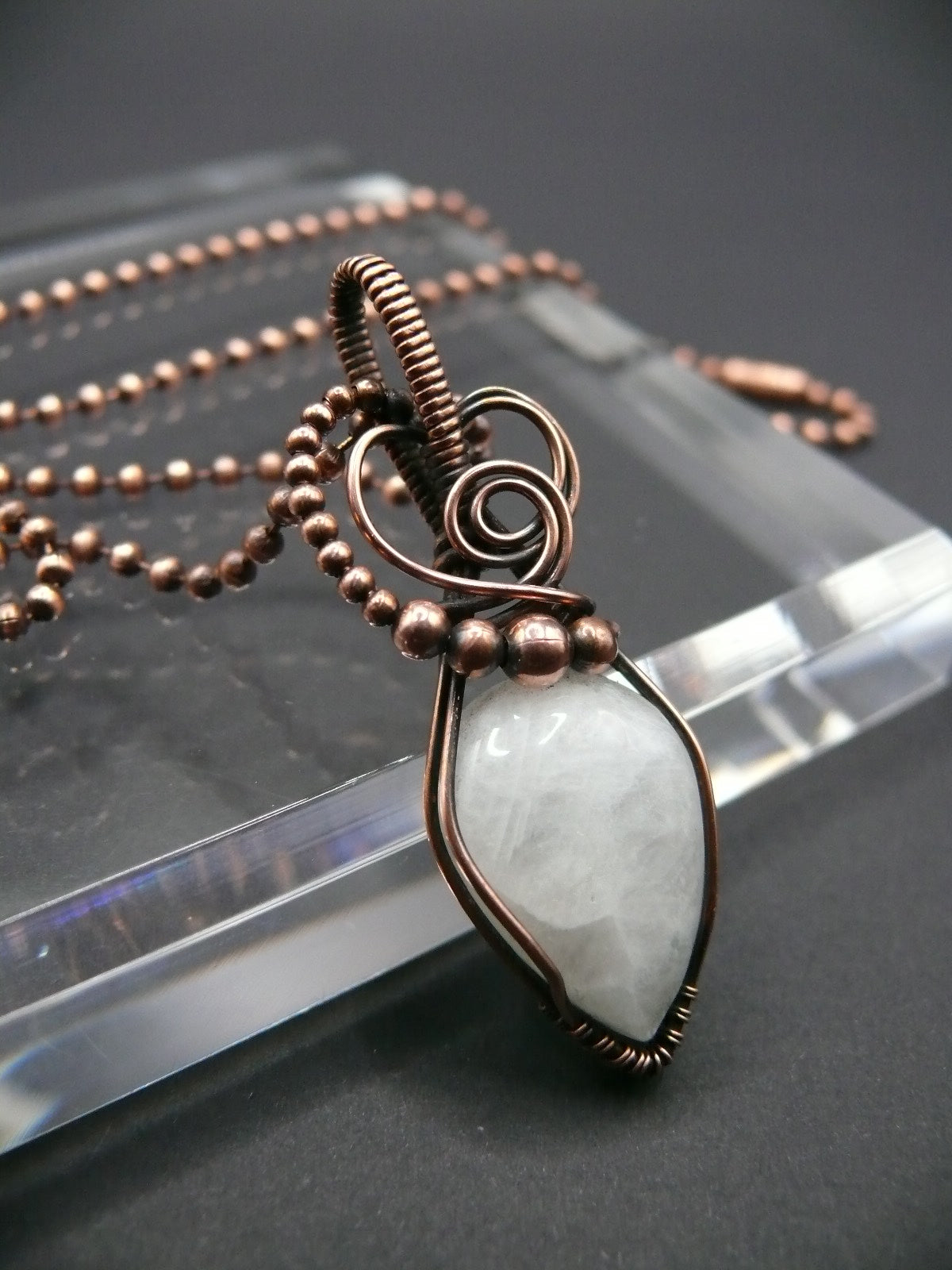 White moonstone gemstone pendant in antiqued copper