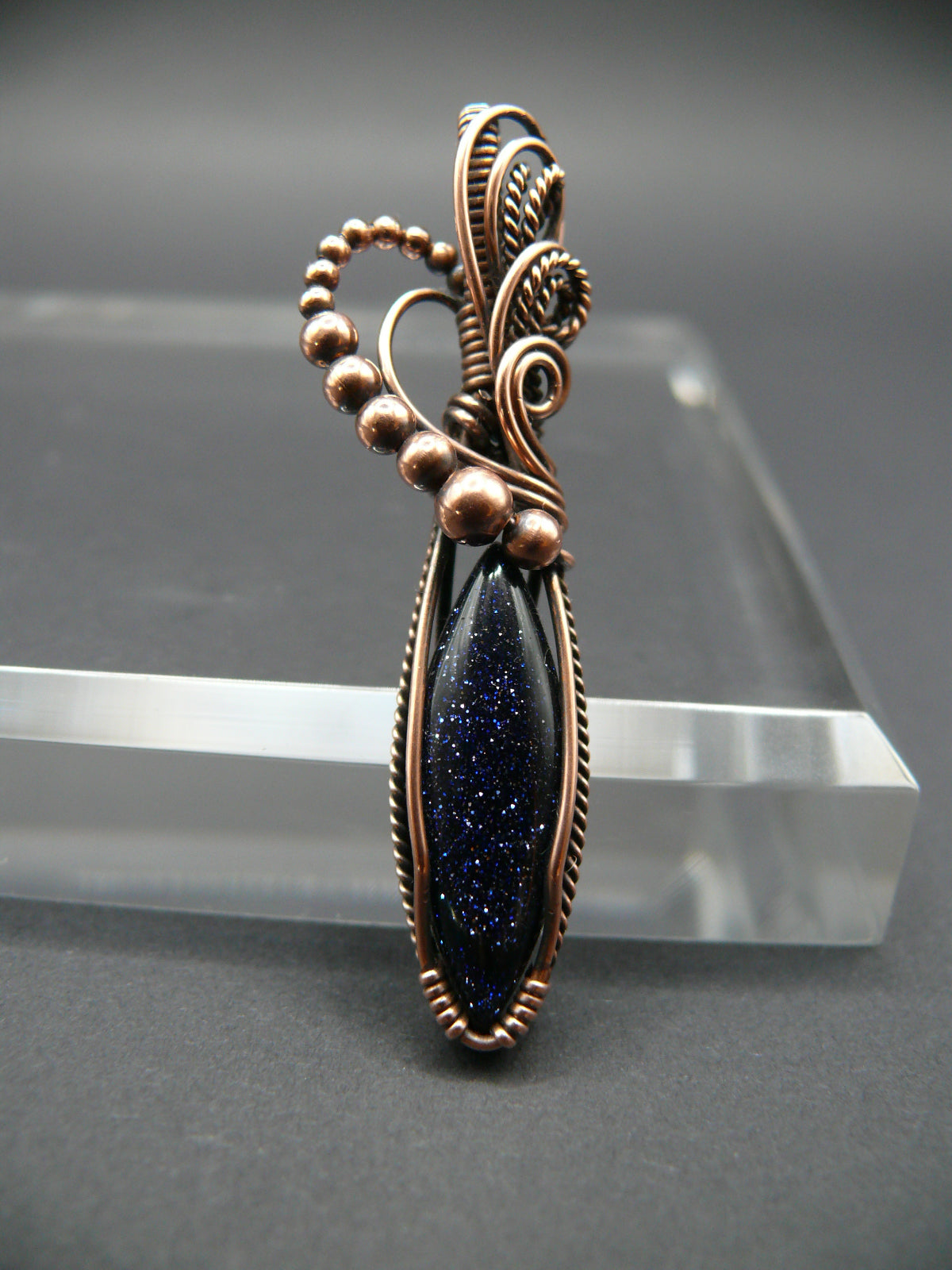 Blue sandstone pendant wire wrapped in copper