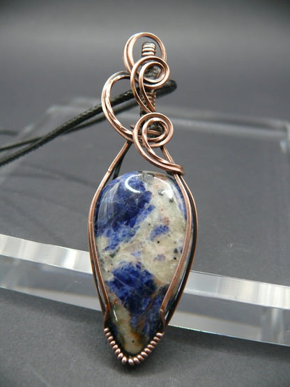 Wire wrapped blue sodalite pendant