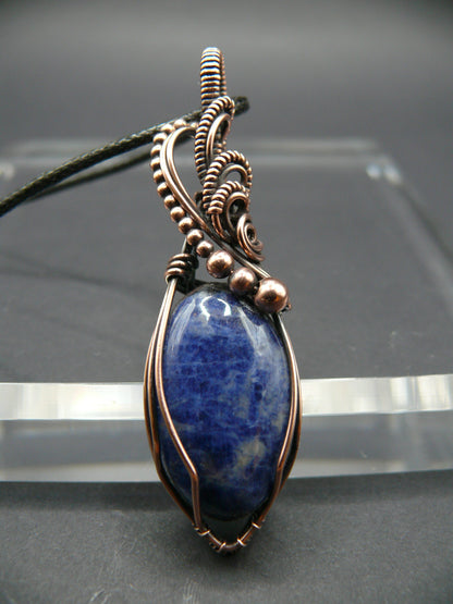 Sodalite pendant wire wrapped in antiqued copper