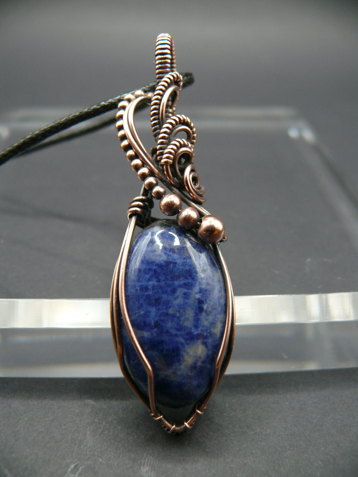 Sodalite pendant wire wrapped in antiqued copper