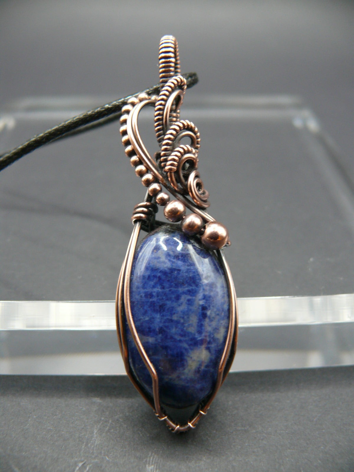 Sodalite pendant wire wrapped in antiqued copper