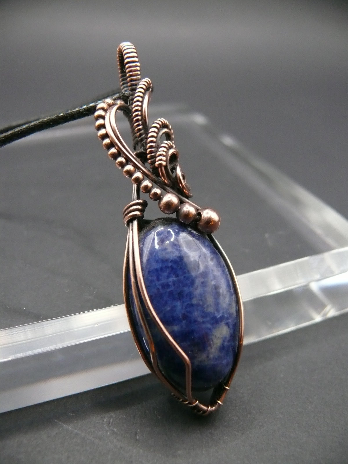 Sodalite pendant wire wrapped in antiqued copper