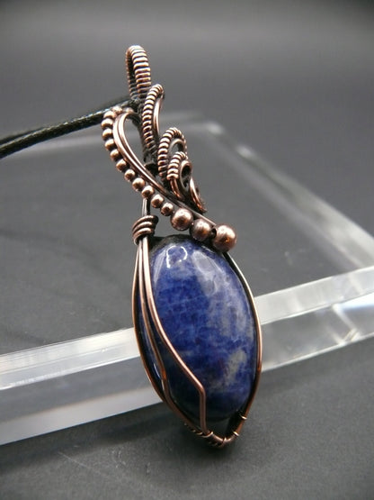 Sodalite pendant wire wrapped in antiqued copper