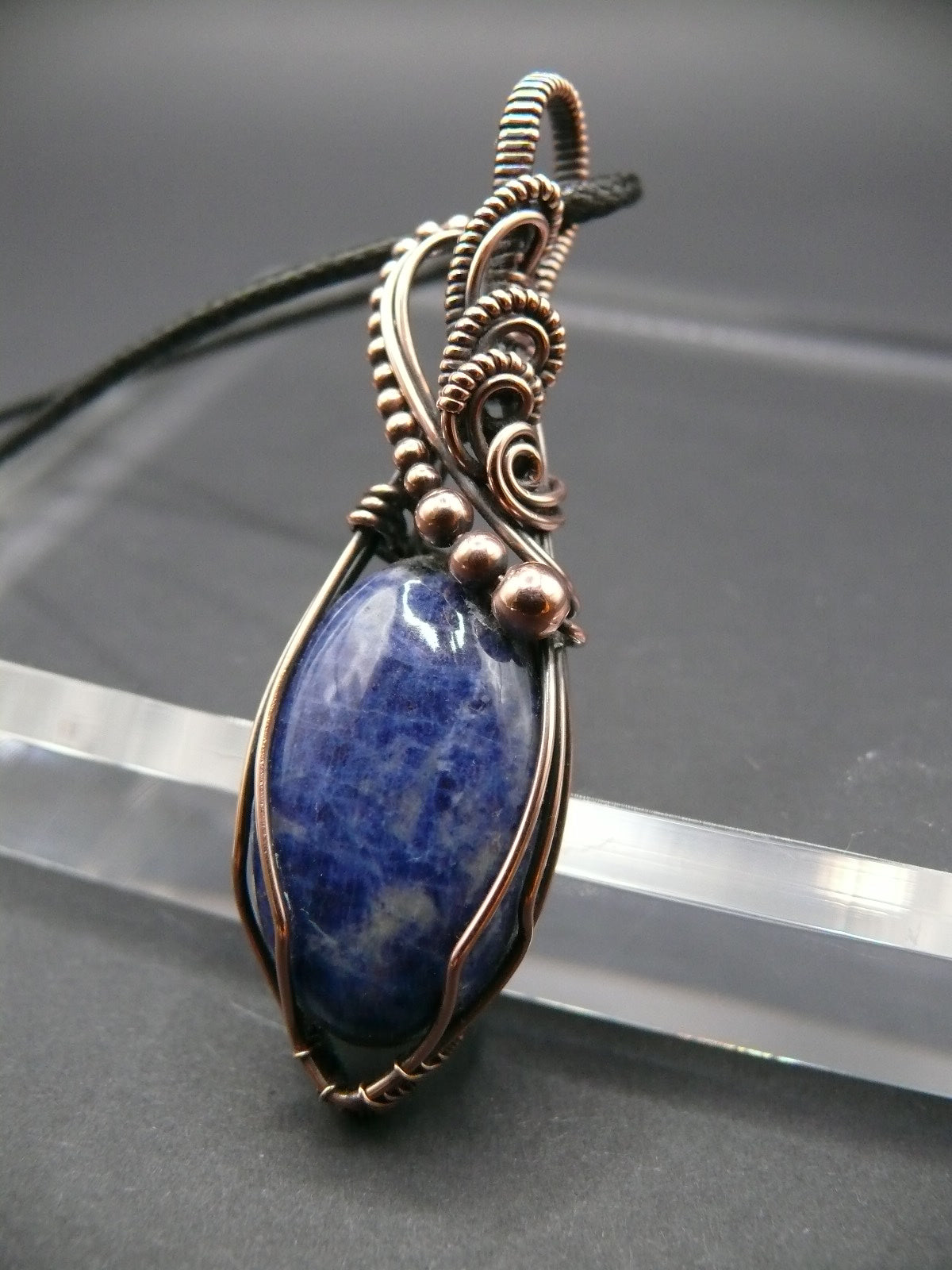 Sodalite pendant wire wrapped in antiqued copper