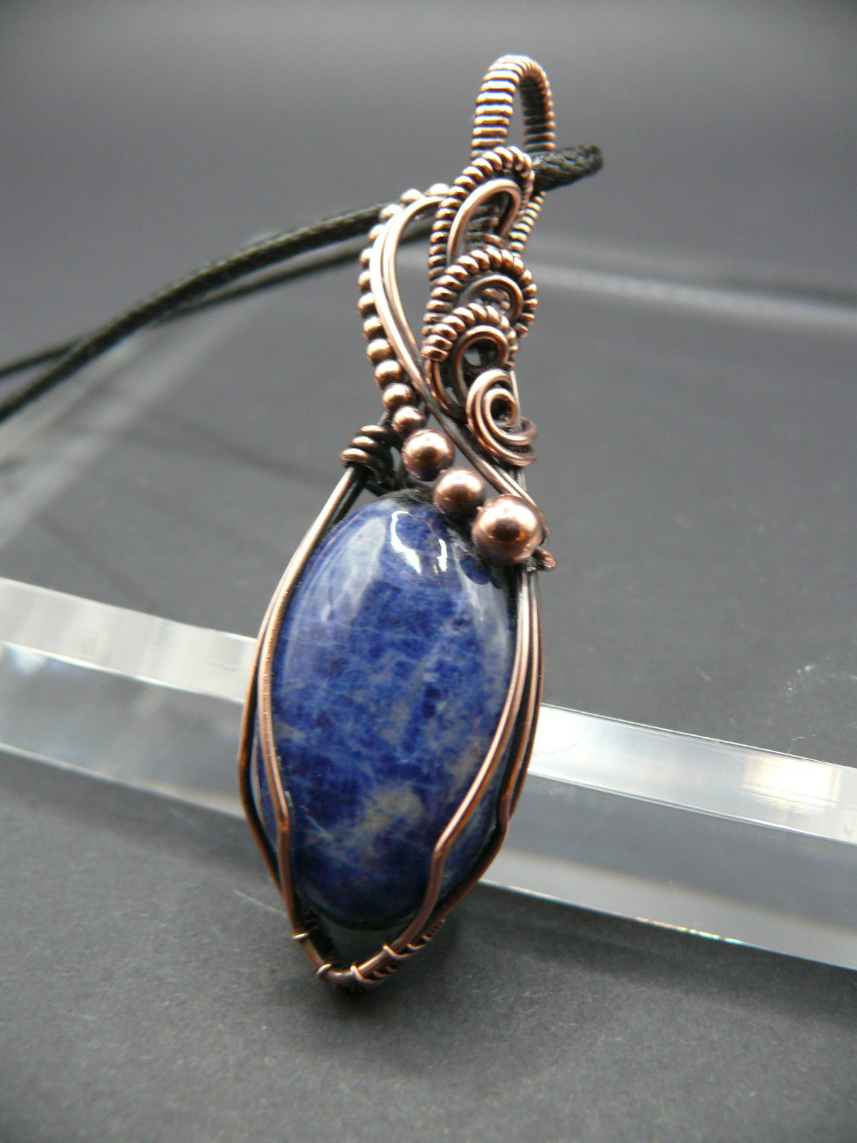 Sodalite pendant wire wrapped in antiqued copper