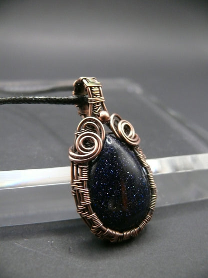 Antiqued wire wrapped blue sandstone pendant