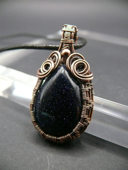 Antiqued wire wrapped blue sandstone pendant