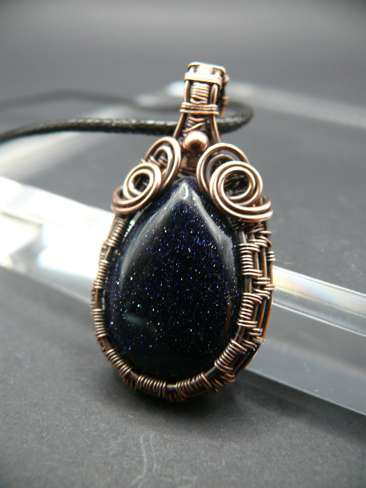 Antiqued wire wrapped blue sandstone pendant