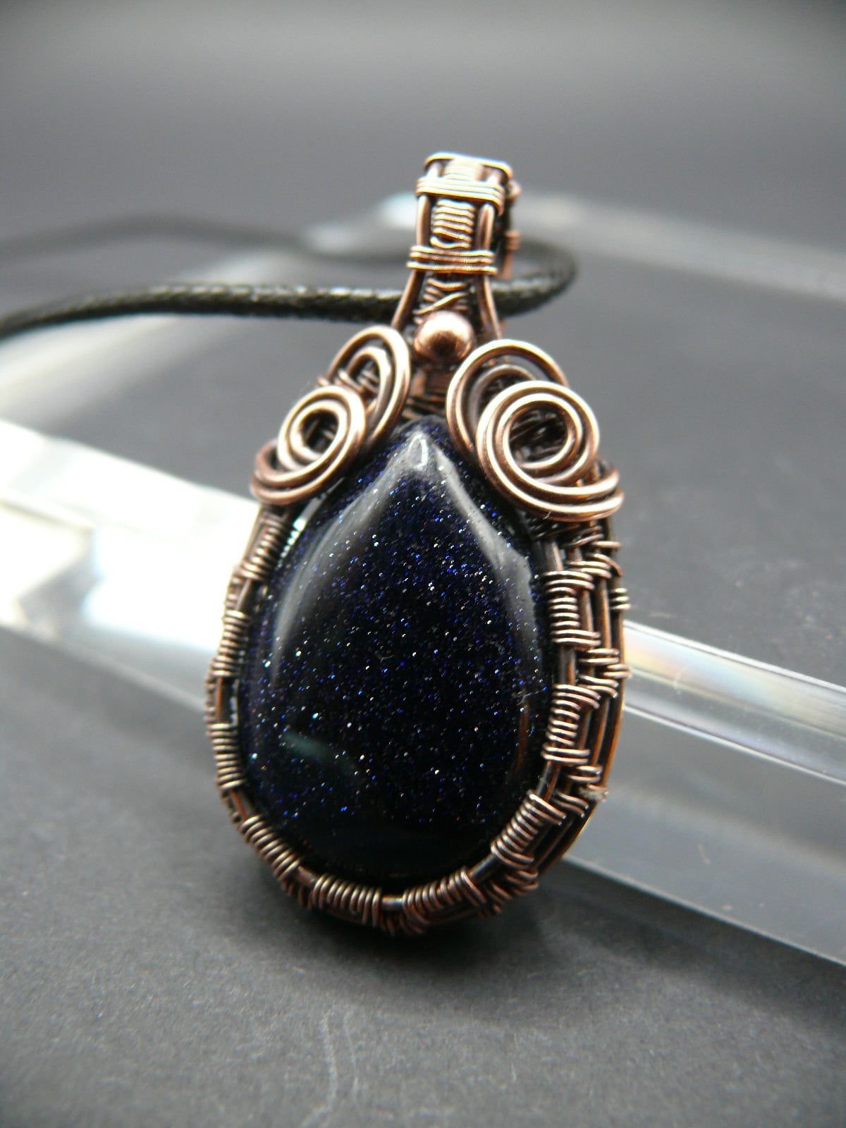 Antiqued wire wrapped blue sandstone pendant