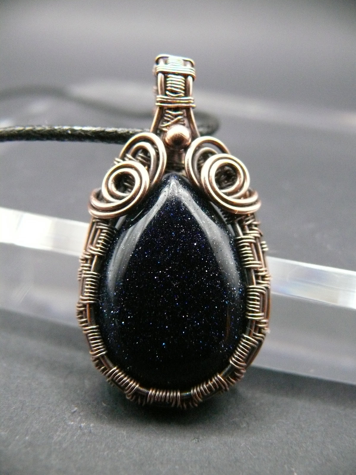 Antiqued wire wrapped blue sandstone pendant