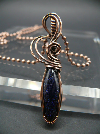 Wire wrapped blue sandstone pendant