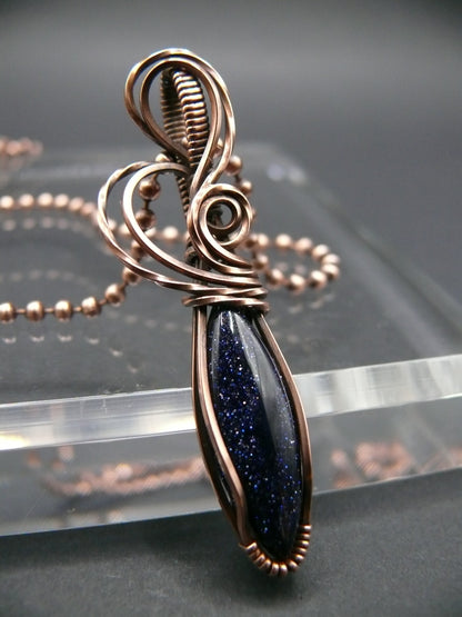 Wire wrapped blue sandstone pendant