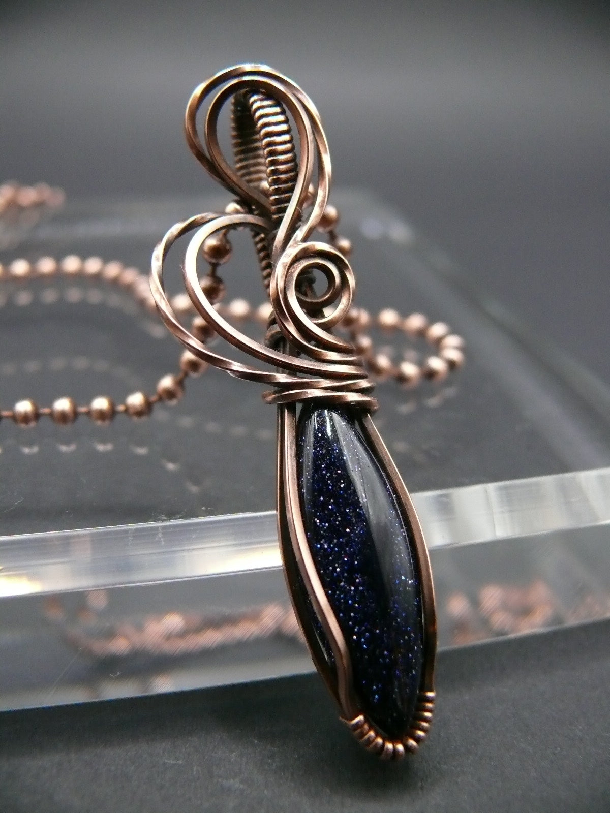 Wire wrapped blue sandstone pendant