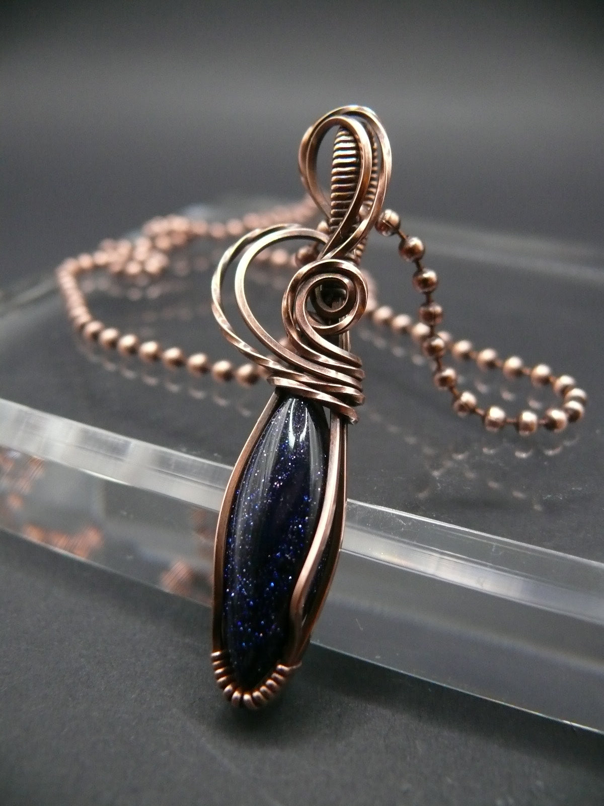 Wire wrapped blue sandstone pendant