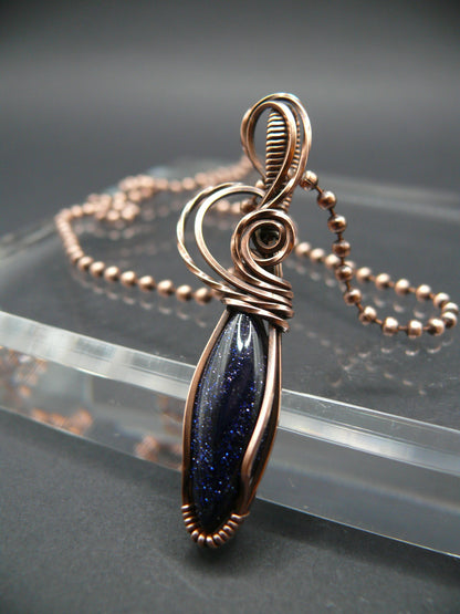 Wire wrapped blue sandstone pendant