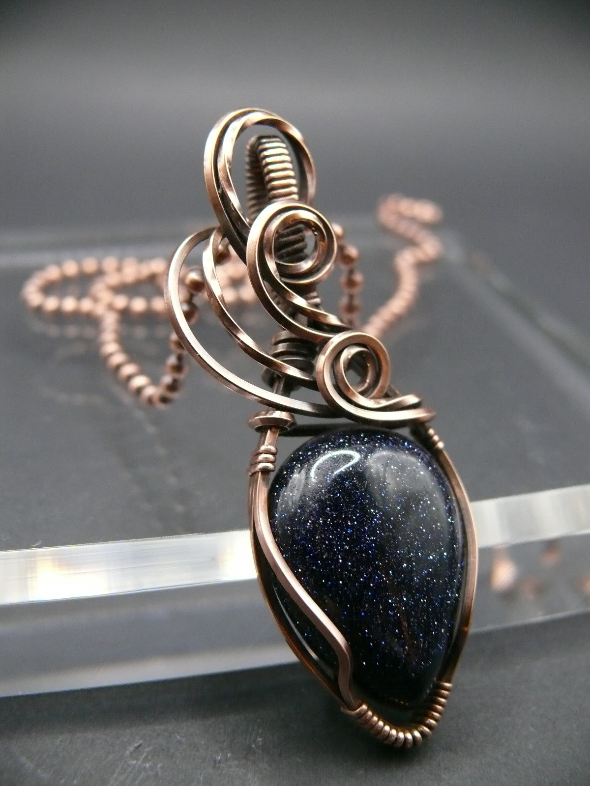 Copper wire wrapped blue sandstone pendant