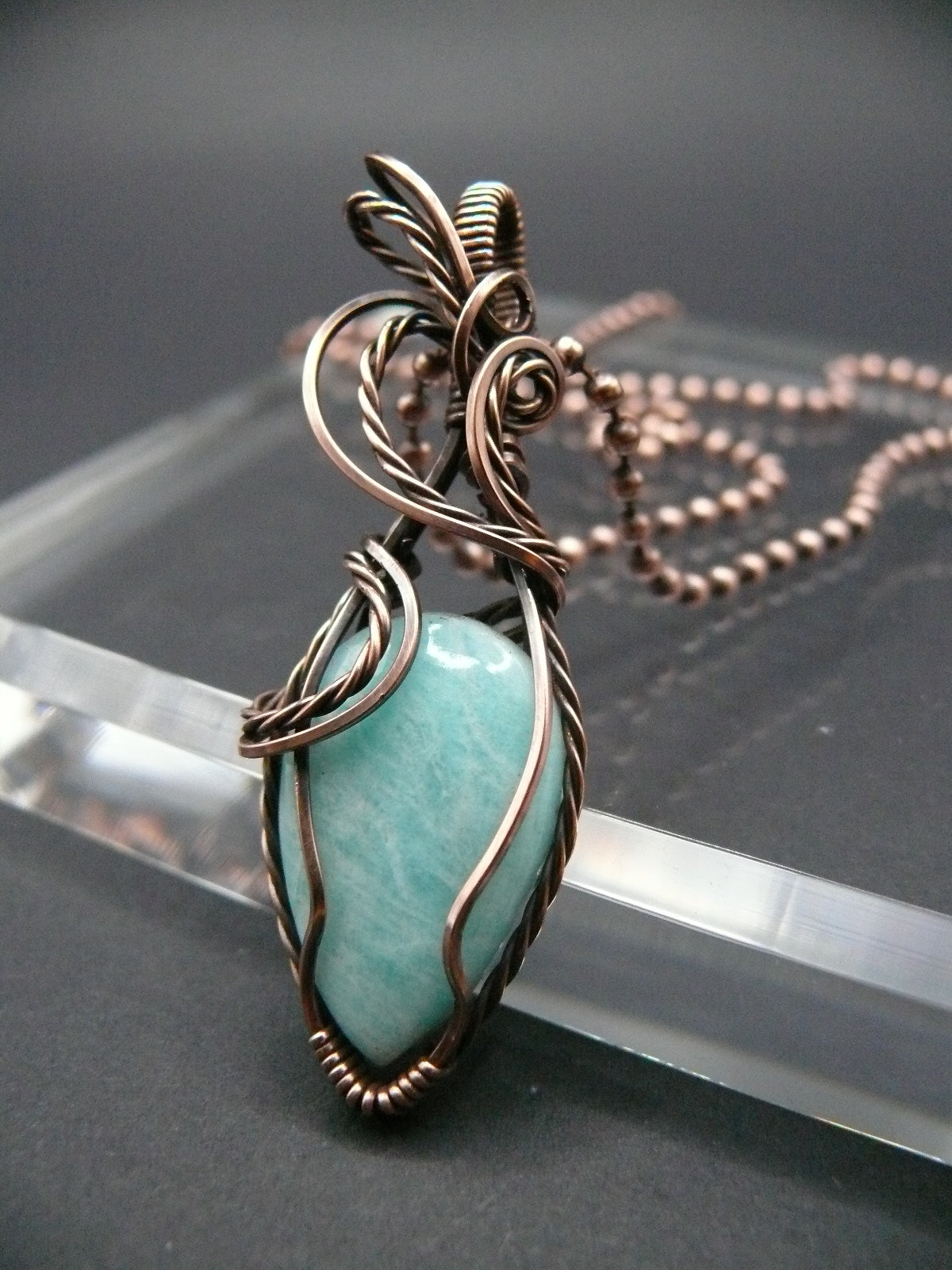 Copper wire wrapped amazonite pendant.