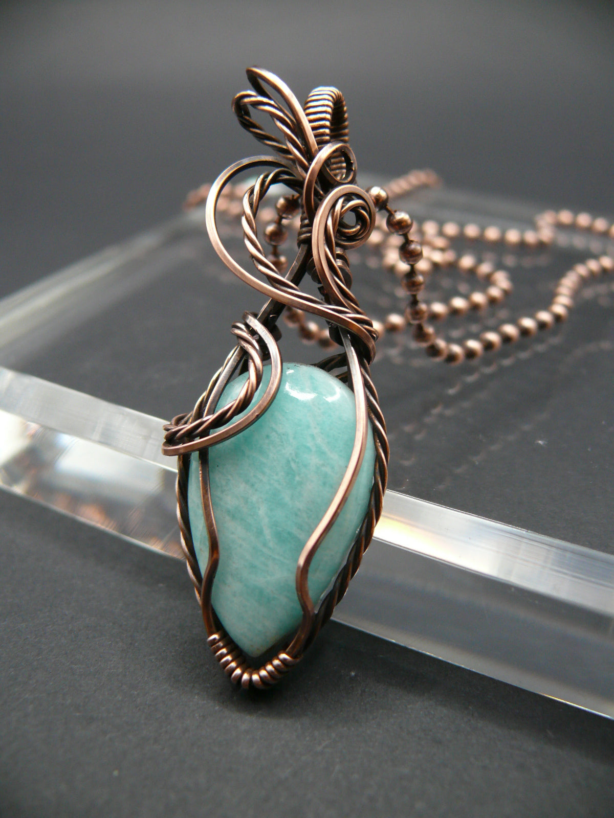 Copper wire wrapped amazonite pendant.