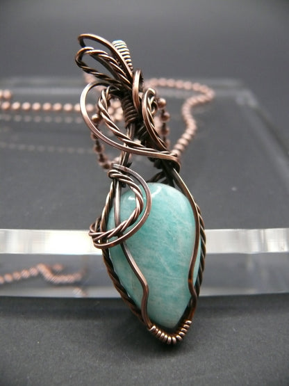 Copper wire wrapped amazonite pendant.