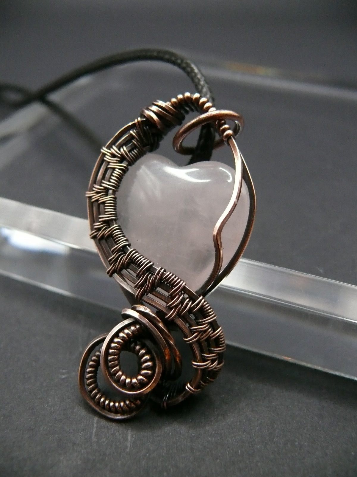 Copper wire-wrapped heart shaped pink rose quartz pendant