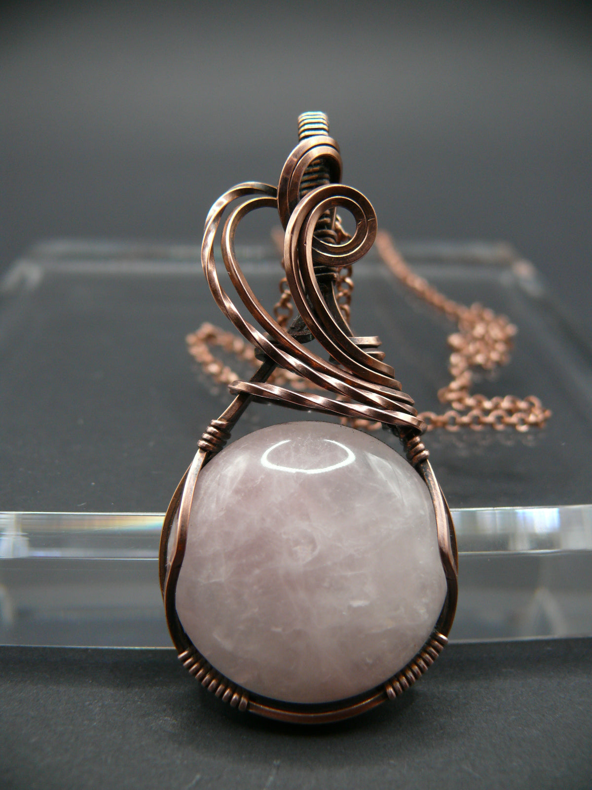 Copper wire wrapped pink rose quartz pendant