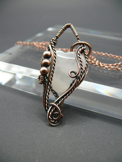 Copper wire-wrapped heart shaped pink rose quartz pendant