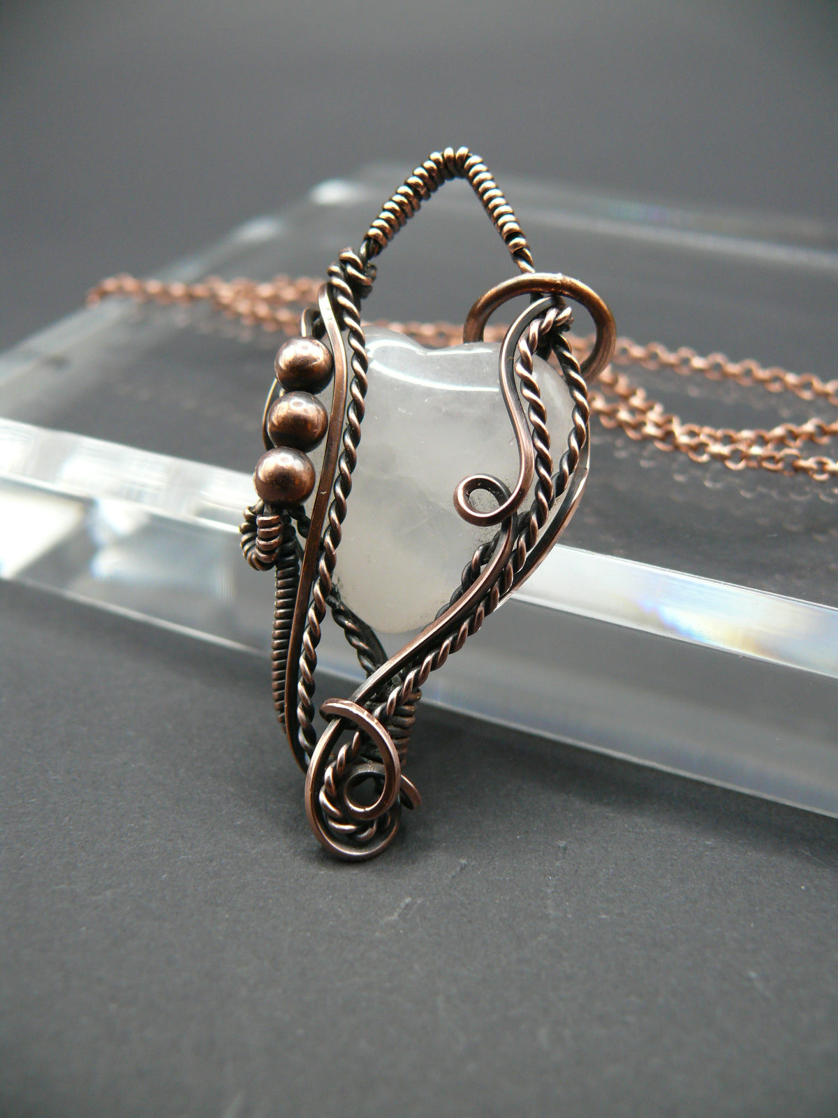 Copper wire-wrapped heart shaped pink rose quartz pendant