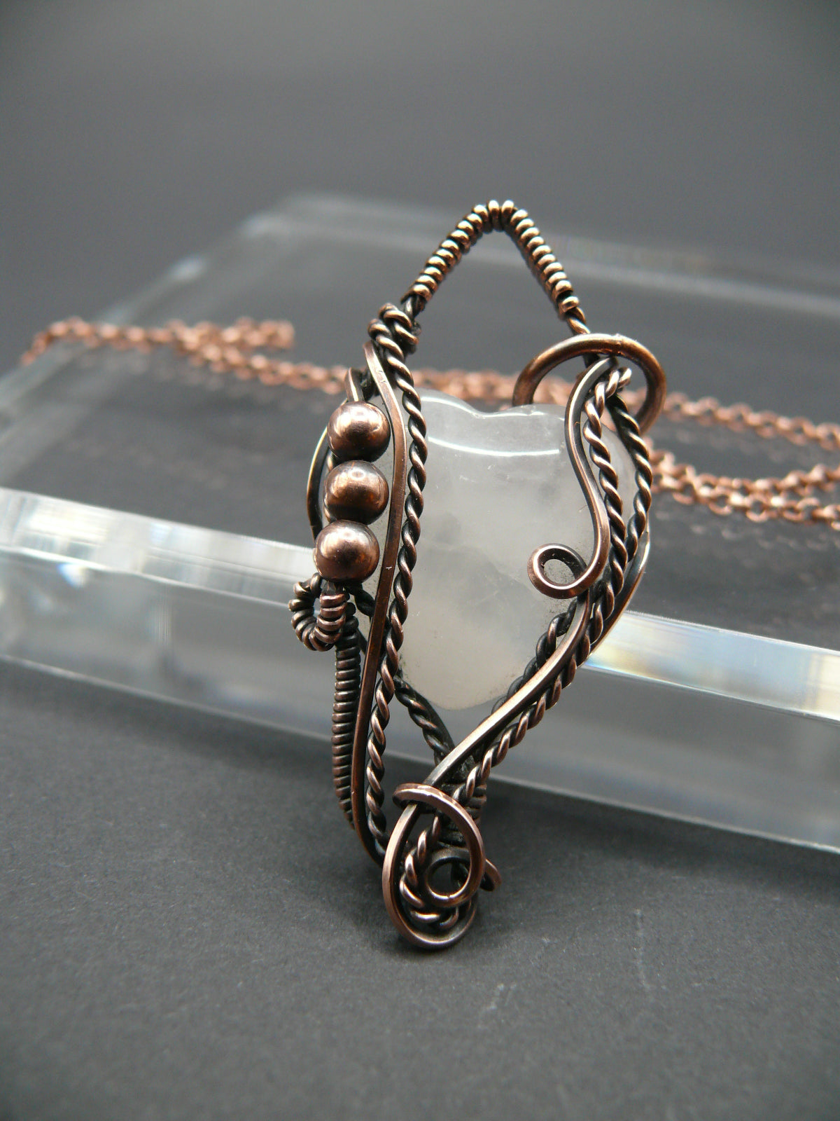 Copper wire-wrapped heart shaped pink rose quartz pendant