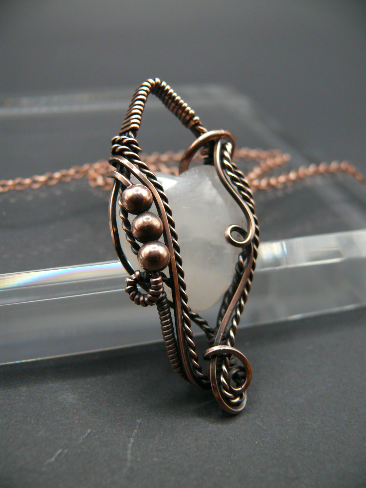 Copper wire-wrapped heart shaped pink rose quartz pendant