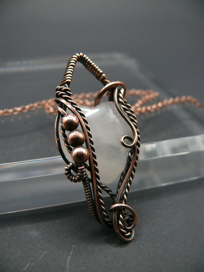 Copper wire-wrapped heart shaped pink rose quartz pendant