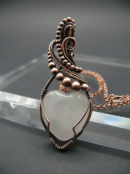 Copper wire-wrapped heart shaped pink rose quartz pendant