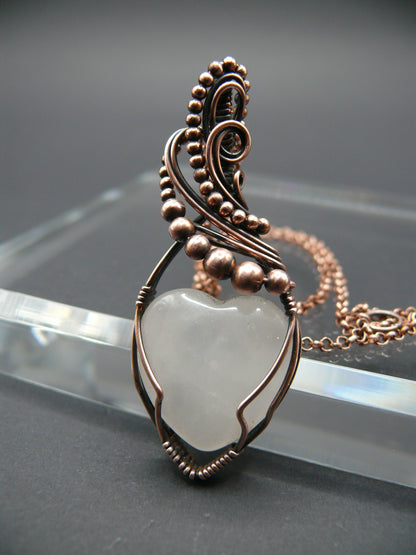 Copper wire-wrapped heart shaped pink rose quartz pendant