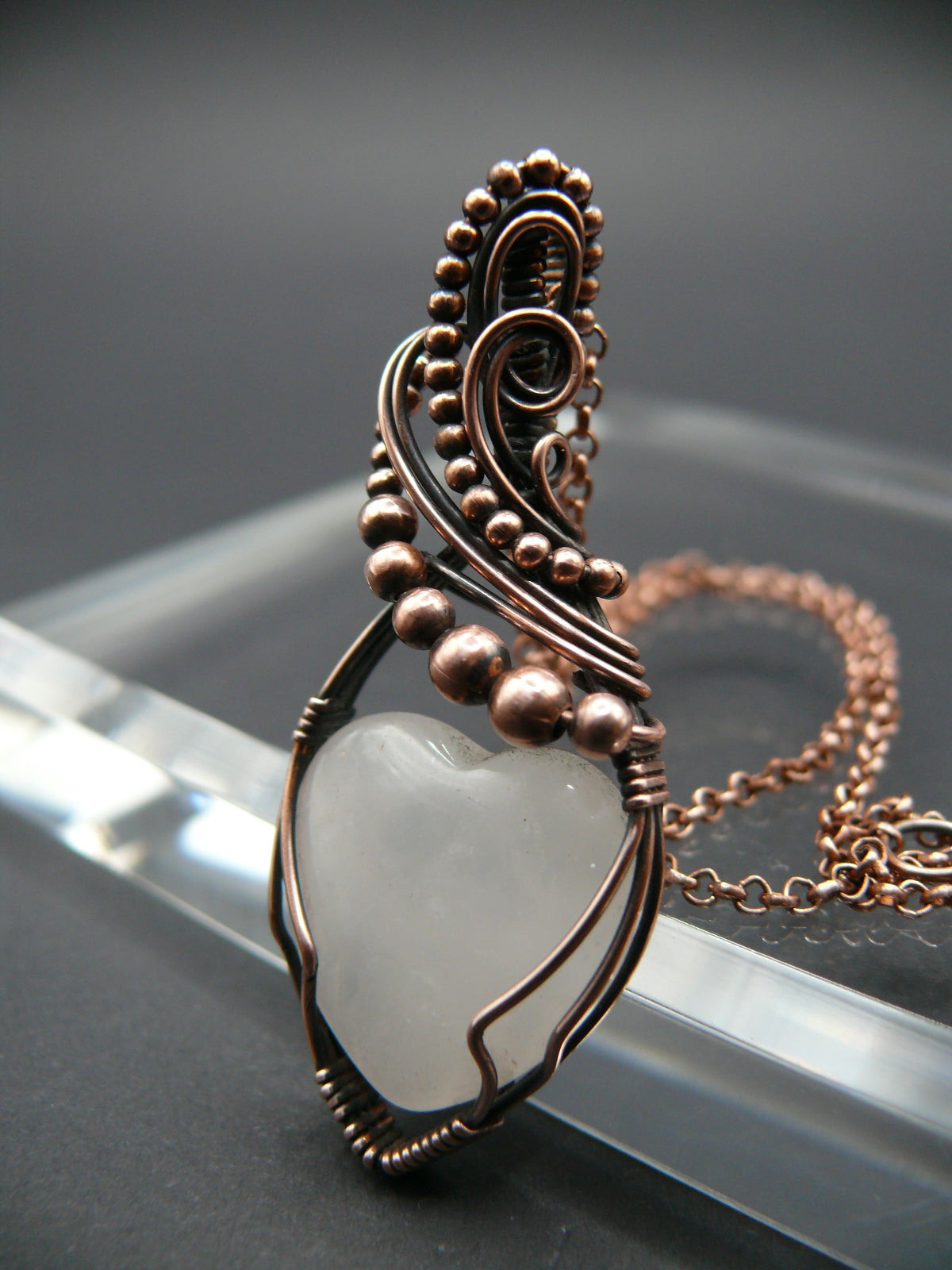 Copper wire-wrapped heart shaped pink rose quartz pendant