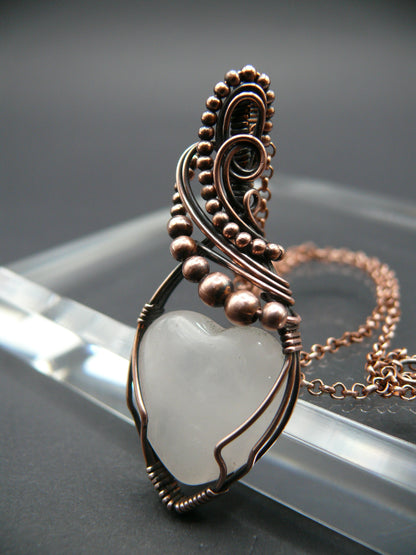 Copper wire-wrapped heart shaped pink rose quartz pendant