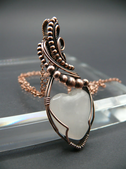 Copper wire-wrapped heart shaped pink rose quartz pendant