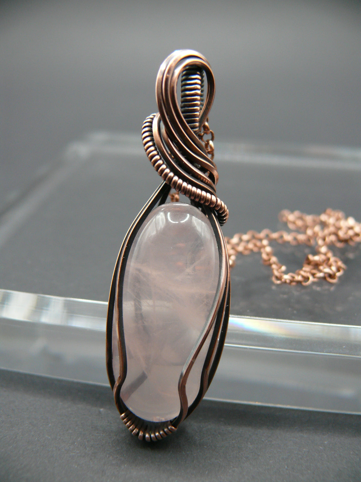 Copper wire wrapped rose quartz pendant