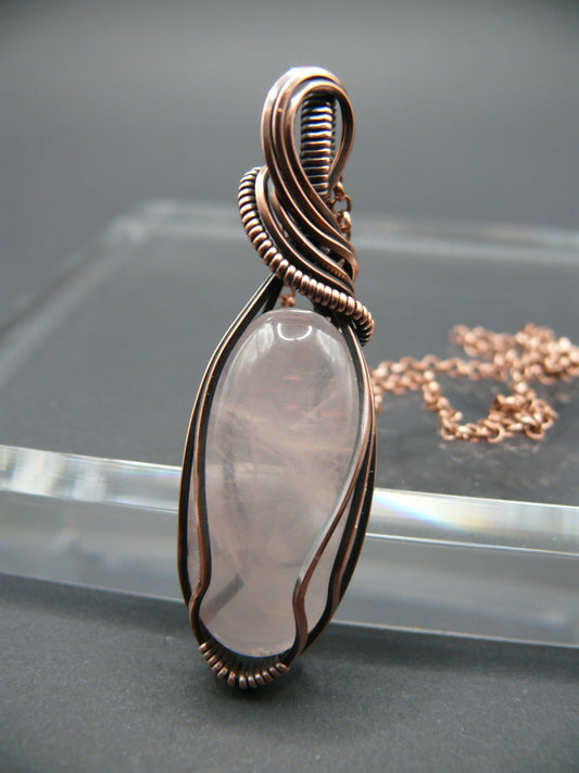 Copper wire wrapped rose quartz pendant