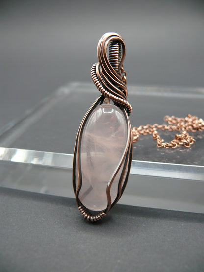 Copper wire wrapped rose quartz pendant