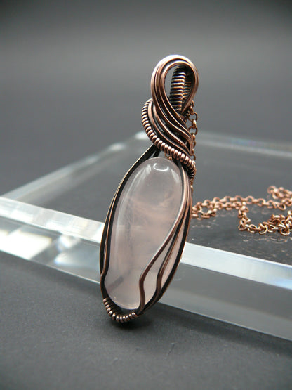 Copper wire wrapped rose quartz pendant