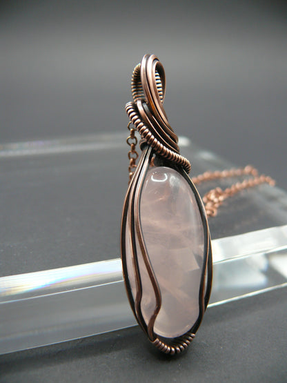 Copper wire wrapped rose quartz pendant